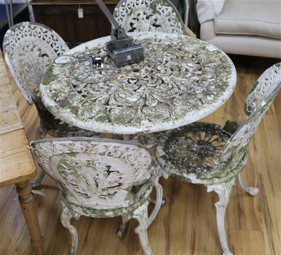 A cast aluminium garden table and four chairs W.82cm